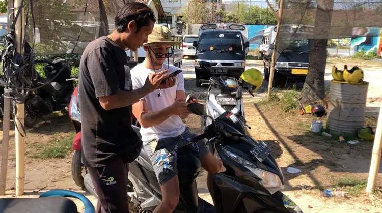 looking at a map on a scooter on nusa penida island