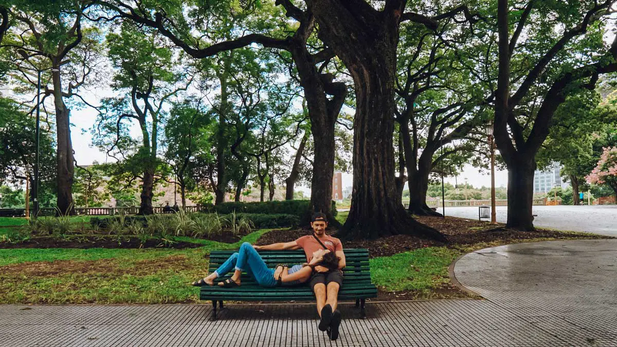 sitting on a bench in plaza san martin