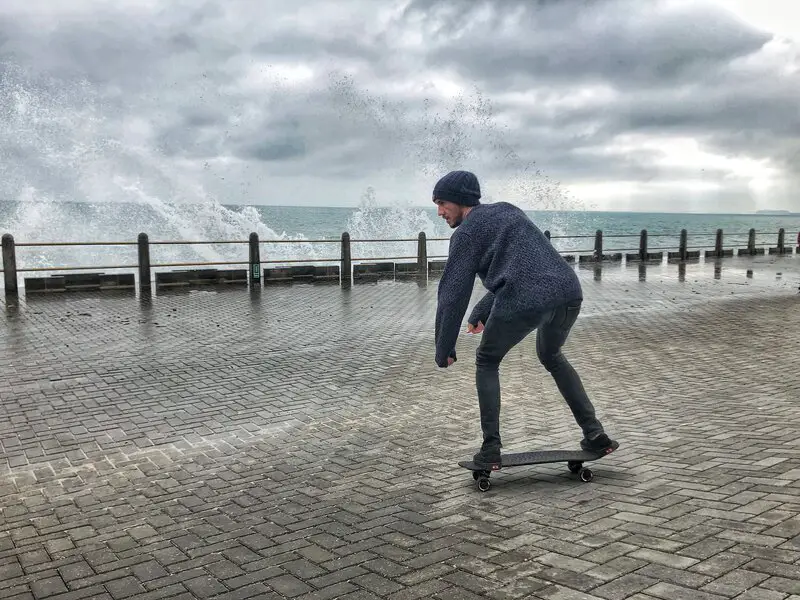 ollie skating by ocean